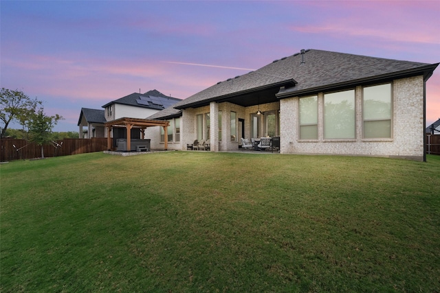 1804 Rockwood Ln, Mansfield, TX 76063 - back of property featuring a patio area, a hot tub, and roof with shingles