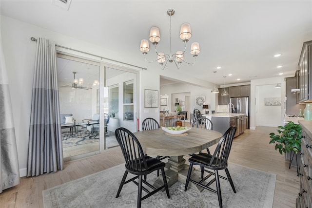10020 Crestview Dr, Denton, TX 76207 - dining space with a chandelier, light wood-style flooring, and recessed lighting