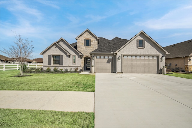 10020 Crestview Dr, Denton, TX 76207 - french country home featuring an attached garage, concrete driveway, stucco siding, and stone siding