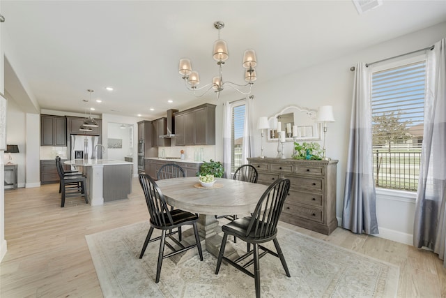 10020 Crestview Dr, Denton, TX 76207 - dining area featuring a chandelier, light wood finished floors, recessed lighting, and baseboards
