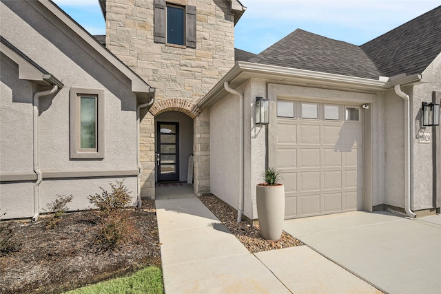 10020 Crestview Dr, Denton, TX 76207 - property entrance featuring stone siding, a garage, roof with shingles, and stucco siding