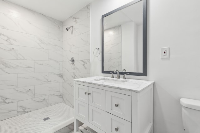 1103 Bowman St, Irving, TX 75060 - full bathroom featuring vanity, tiled shower, and toilet