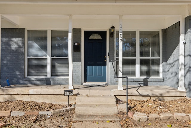 1103 Bowman St, Irving, TX 75060 - entrance to property featuring a porch and brick siding