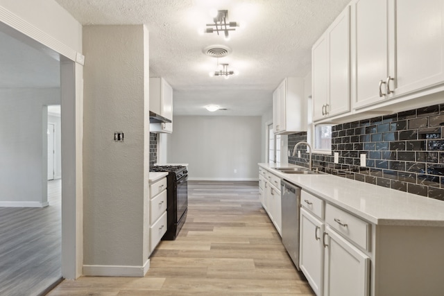 1103 Bowman St, Irving, TX 75060 - kitchen featuring black range with gas stovetop, a sink, stainless steel dishwasher, baseboards, and backsplash