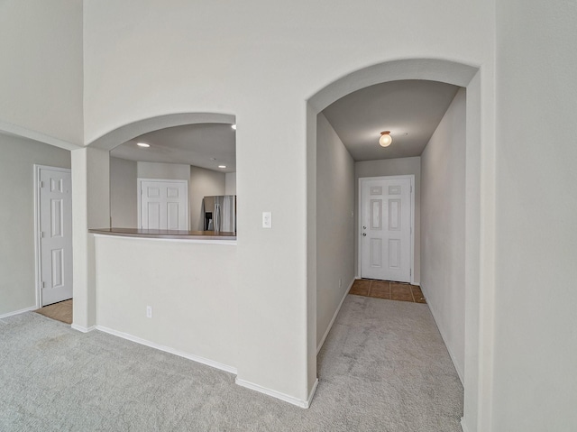 1159 Landon Ln, Allen, TX 75013 - hallway featuring arched walkways, carpet floors, baseboards, and recessed lighting