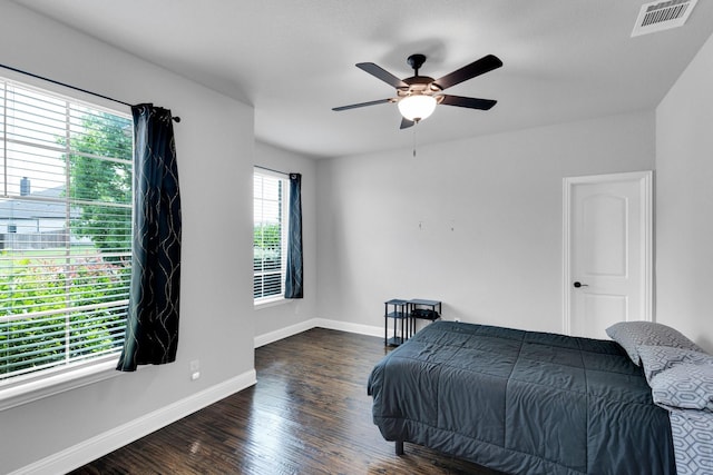 1708 Stillwater Dr, Burleson, TX 76028 - bedroom with dark wood-style floors, baseboards, and ceiling fan