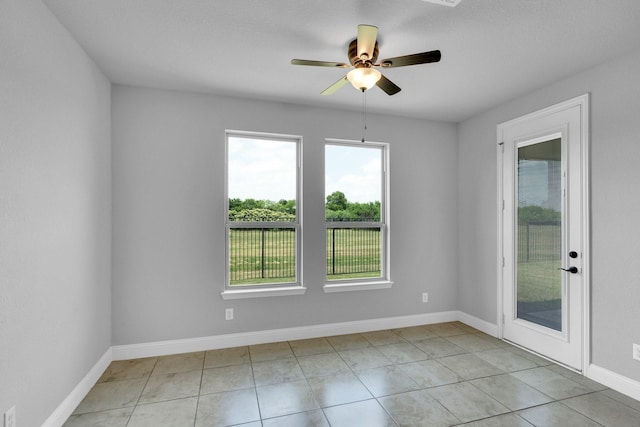 1708 Stillwater Dr, Burleson, TX 76028 - empty room featuring ceiling fan, baseboards, and light tile patterned flooring