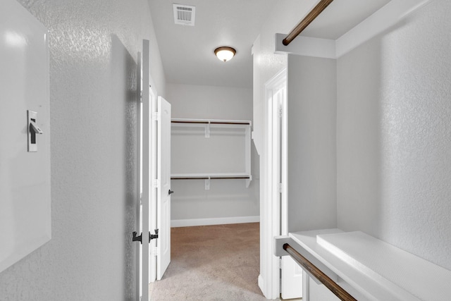 1708 Stillwater Dr, Burleson, TX 76028 - walk in closet featuring light colored carpet