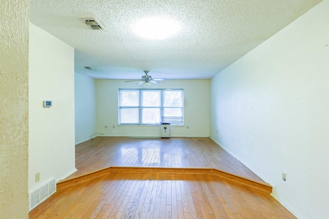 6604 Ems Ct, Fort Worth, TX 76487 - spare room with a ceiling fan, light wood finished floors, and a textured ceiling
