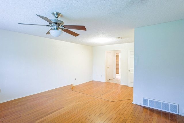 6604 Ems Ct, Fort Worth, TX 76487 - spare room featuring light wood-style floors, a textured ceiling, and ceiling fan