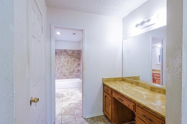 6604 Ems Ct, Fort Worth, TX 76487 - bathroom with vanity, tile patterned floors, a textured ceiling, and shower / tub combination