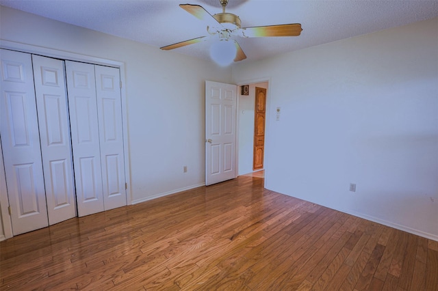 6604 Ems Ct, Fort Worth, TX 76487 - unfurnished bedroom featuring wood finished floors, a closet, baseboards, and a ceiling fan
