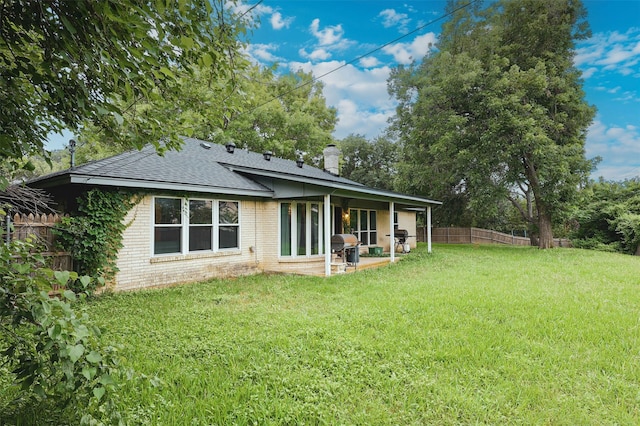 6604 Ems Ct, Fort Worth, TX 76487 - back of house with brick siding, roof with shingles, a patio, and a chimney