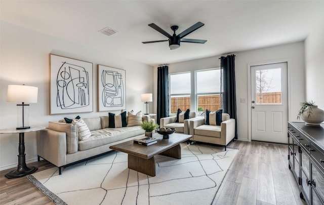 2402 Carlow Ln, Lowry Crossing, TX 75407 - living area with light wood-style floors, ceiling fan, and baseboards