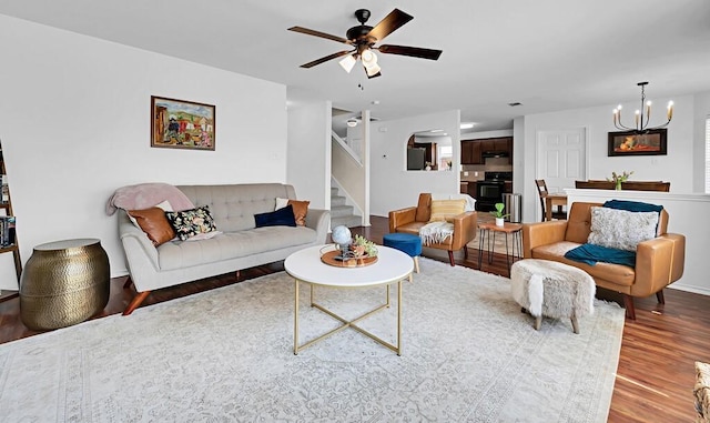 6608 Costa Dr, Waco, TX 76712 - living room featuring wood finished floors, stairway, ceiling fan, a chandelier, and baseboards