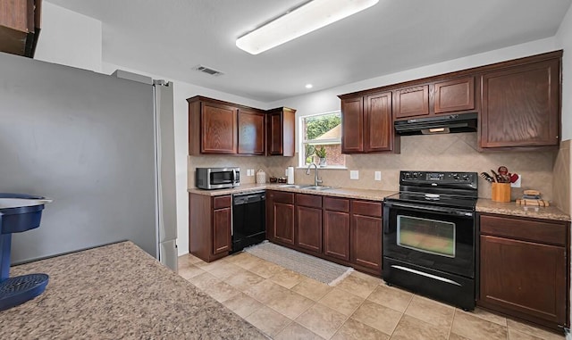 6608 Costa Dr, Waco, TX 76712 - kitchen featuring black appliances, under cabinet range hood, a sink, backsplash, and dark brown cabinetry