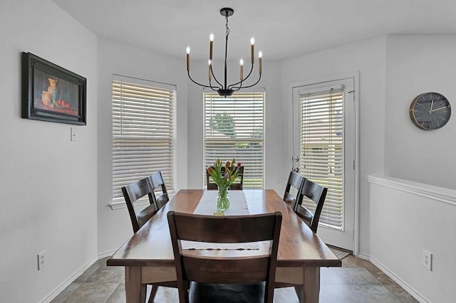 6608 Costa Dr, Waco, TX 76712 - dining area with a chandelier and baseboards