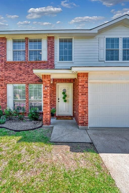 6608 Costa Dr, Waco, TX 76712 - view of front of house with brick siding, an attached garage, and concrete driveway