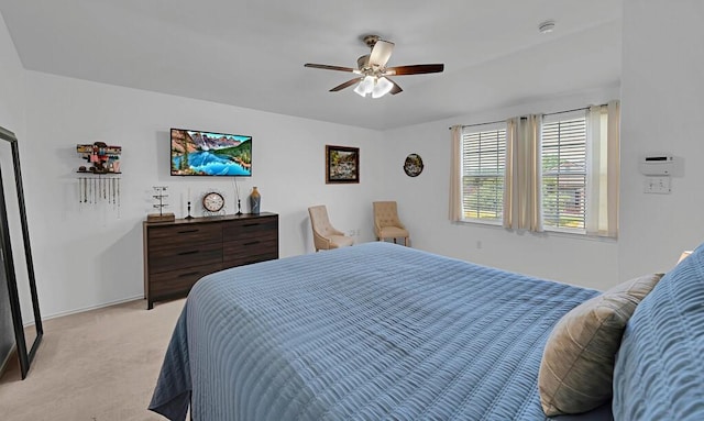 6608 Costa Dr, Waco, TX 76712 - bedroom with light colored carpet, a ceiling fan, and baseboards