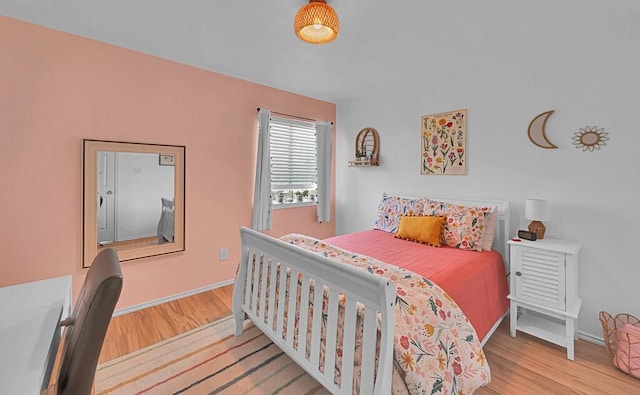 6608 Costa Dr, Waco, TX 76712 - bedroom with wood finished floors and baseboards