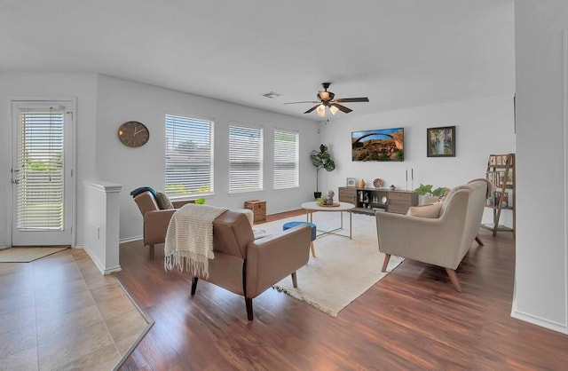 6608 Costa Dr, Waco, TX 76712 - living area featuring ceiling fan, healthy amount of natural light, and baseboards