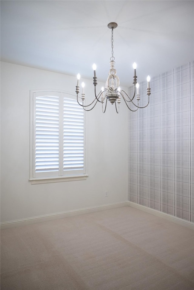 6032 Forest Ln, Fort Worth, TX 76112 - carpeted empty room featuring a chandelier and baseboards