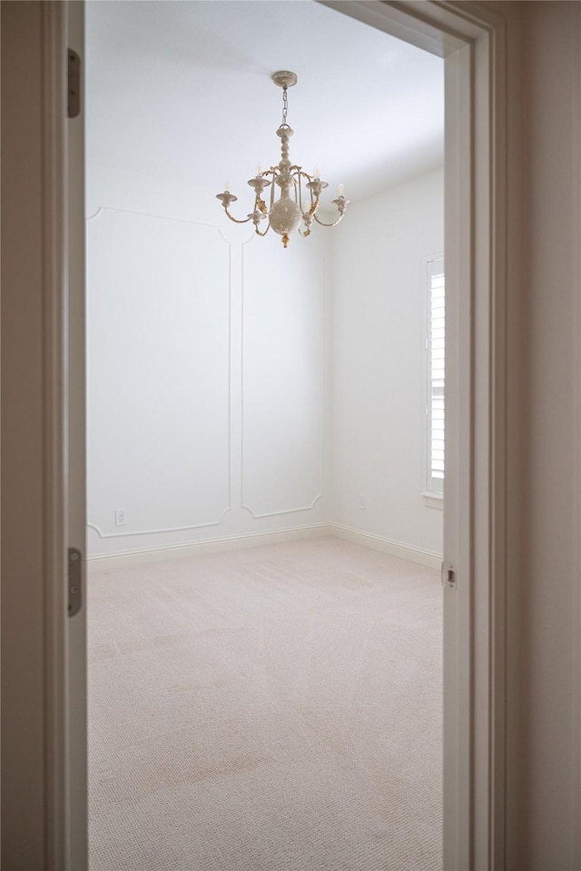 6032 Forest Ln, Fort Worth, TX 76112 - carpeted spare room with a chandelier and baseboards