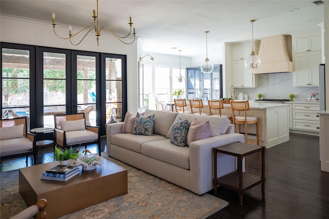 6032 Forest Ln, Fort Worth, TX 76112 - living area featuring dark wood-type flooring, a chandelier, and french doors