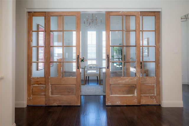 6032 Forest Ln, Fort Worth, TX 76112 - doorway to outside with wood finished floors, a chandelier, and baseboards