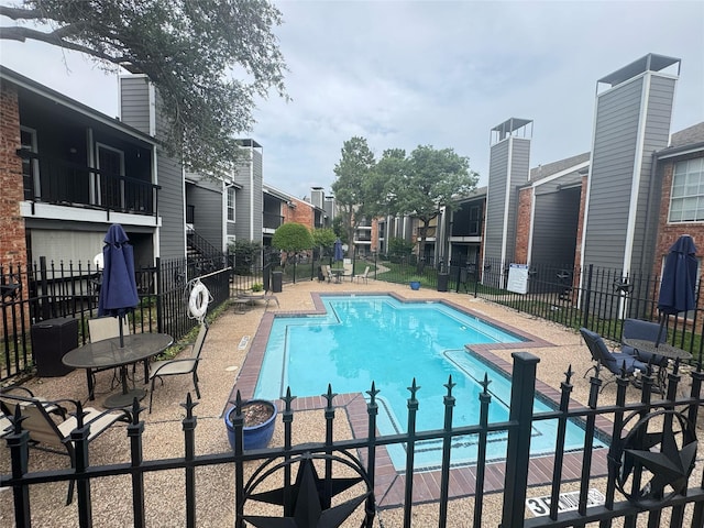 18333 Roehampton Dr Unit 1031, Dallas, TX 75252 - community pool featuring a residential view and a patio