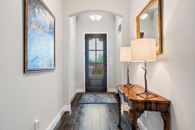 8112 Western, The Colony, TX 75056 - entryway featuring dark wood finished floors, arched walkways, and baseboards