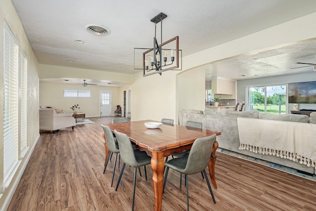 10 Estates Rd, Lucas, TX 75002 - dining room with ceiling fan, wood finished floors, healthy amount of natural light, and a chandelier