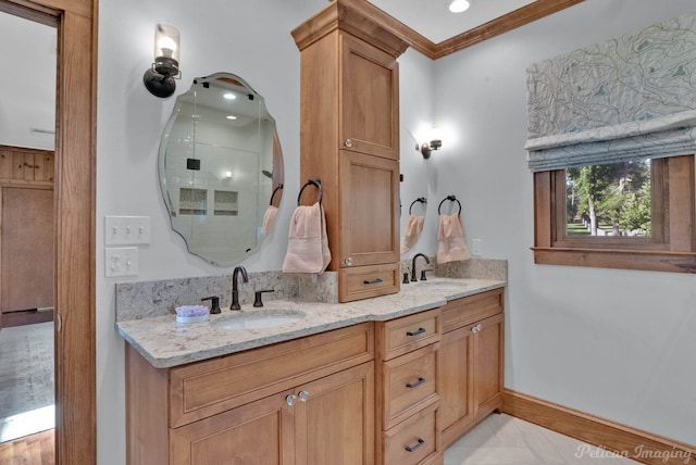 5305 S Lakeshore Dr, Shreveport, LA 71109 - bathroom with double vanity, an enclosed shower, baseboards, and crown molding