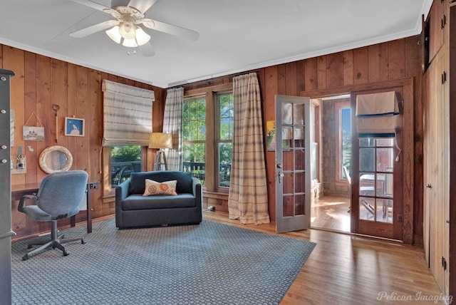 5305 S Lakeshore Dr, Shreveport, LA 71109 - office featuring wood walls, crown molding, french doors, ceiling fan, and wood finished floors
