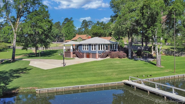 5305 S Lakeshore Dr, Shreveport, LA 71109 - rear view of property featuring stairway, a lawn, and a deck with water view