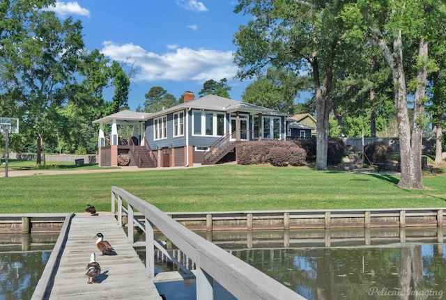 5305 S Lakeshore Dr, Shreveport, LA 71109 - rear view of house with stairs, a sunroom, a water view, and a yard