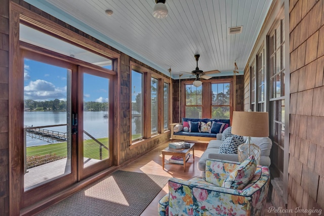 5305 S Lakeshore Dr, Shreveport, LA 71109 - sunroom / solarium featuring a ceiling fan, a water view, and an outdoor living space