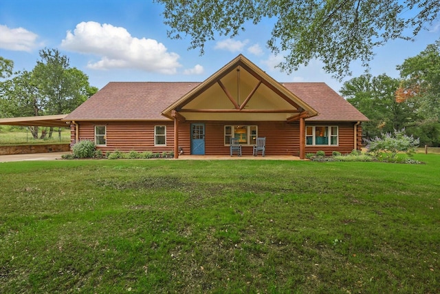 127 Pleasant Valley Ln, Weatherford, TX 76087 - log cabin with a front yard, log siding, an attached carport, and roof with shingles