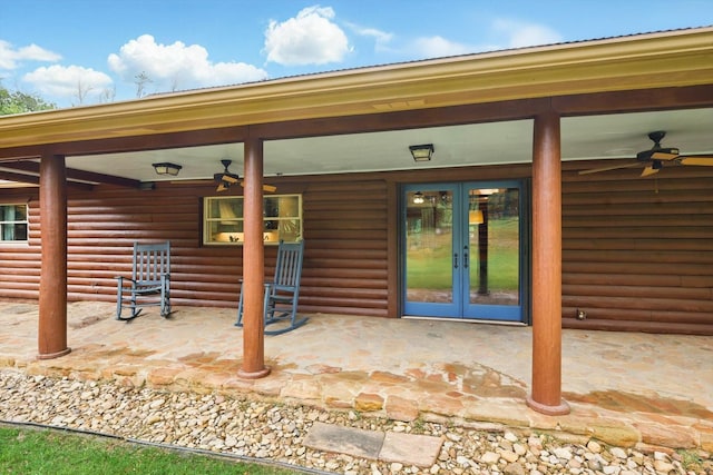 127 Pleasant Valley Ln, Weatherford, TX 76087 - property entrance featuring french doors, a ceiling fan, and faux log siding