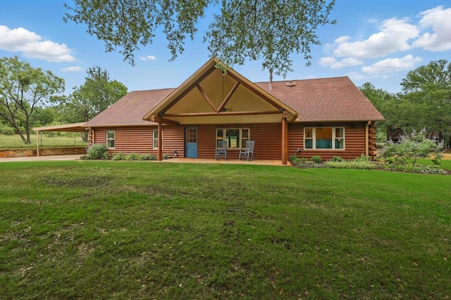 127 Pleasant Valley Ln, Weatherford, TX 76087 - log home with log exterior, a front yard, roof with shingles, and a carport