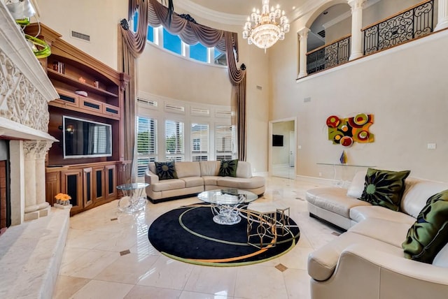 1751 Bison Meadow Ln, Heath, TX 75032 - living room featuring a towering ceiling, a chandelier, a fireplace with raised hearth, ornamental molding, and baseboards