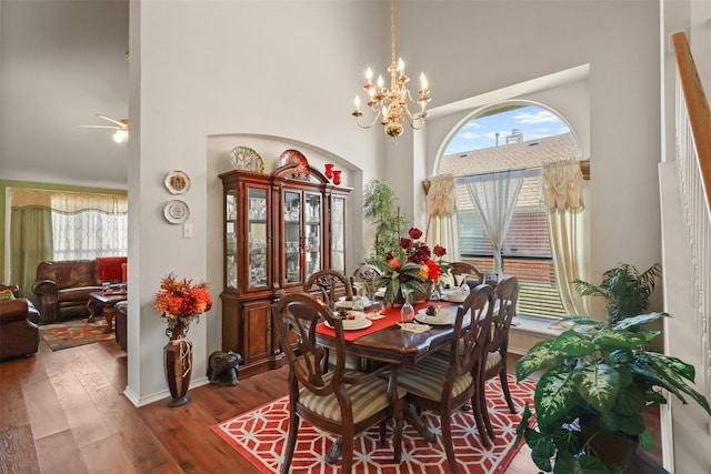 408 Autumn Park Park, Fort Worth, TX 76140 - dining area with a towering ceiling, healthy amount of natural light, wood finished floors, a chandelier, and a ceiling fan