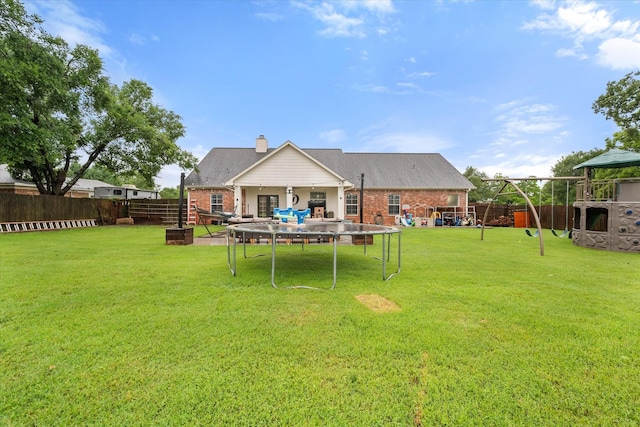 430 Oak Ridge Dr, Fairfield, TX 75840 - view of yard featuring a trampoline and a playground