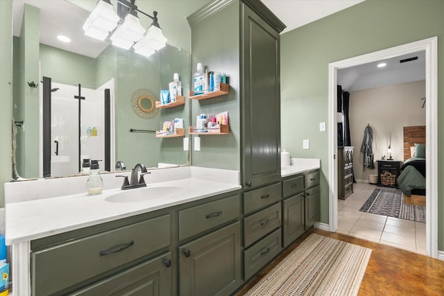430 Oak Ridge Dr, Fairfield, TX 75840 - full bathroom featuring double vanity, ensuite bath, an enclosed shower, and tile patterned flooring
