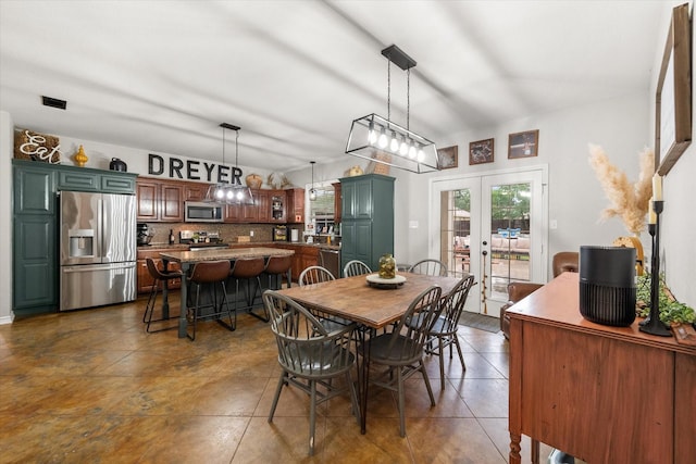 430 Oak Ridge Dr, Fairfield, TX 75840 - dining space featuring french doors and vaulted ceiling