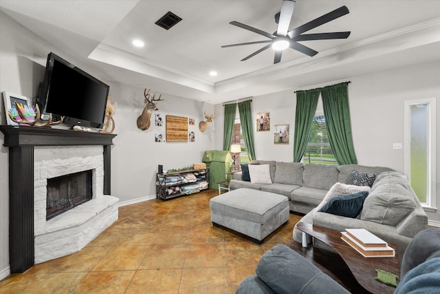 430 Oak Ridge Dr, Fairfield, TX 75840 - living room with ceiling fan, a stone fireplace, crown molding, recessed lighting, and a tray ceiling