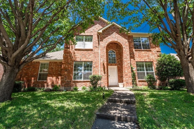5900 Pine Meadow Ln, Mckinney, TX 75070 - traditional-style home with a front lawn and brick siding