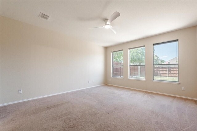 5900 Pine Meadow Ln, Mckinney, TX 75070 - spare room with a ceiling fan, light carpet, and baseboards