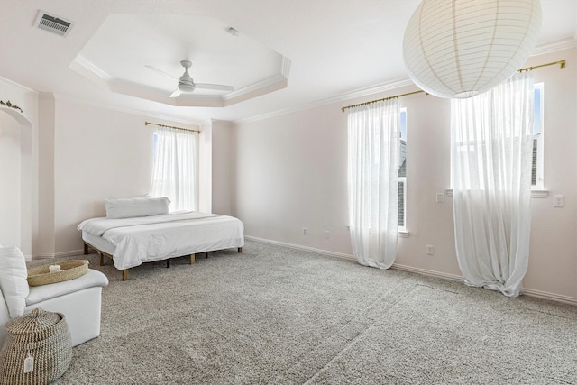 16012 Alvarado Dr, Prosper, TX 75078 - carpeted bedroom with crown molding, ceiling fan, baseboards, and a tray ceiling