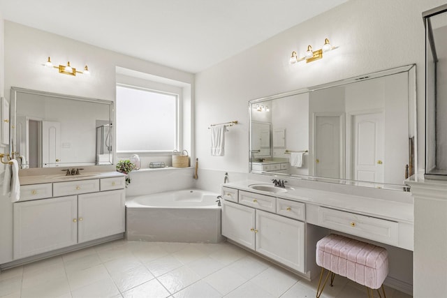 16012 Alvarado Dr, Prosper, TX 75078 - bathroom featuring a bath, two vanities, and tile patterned floors